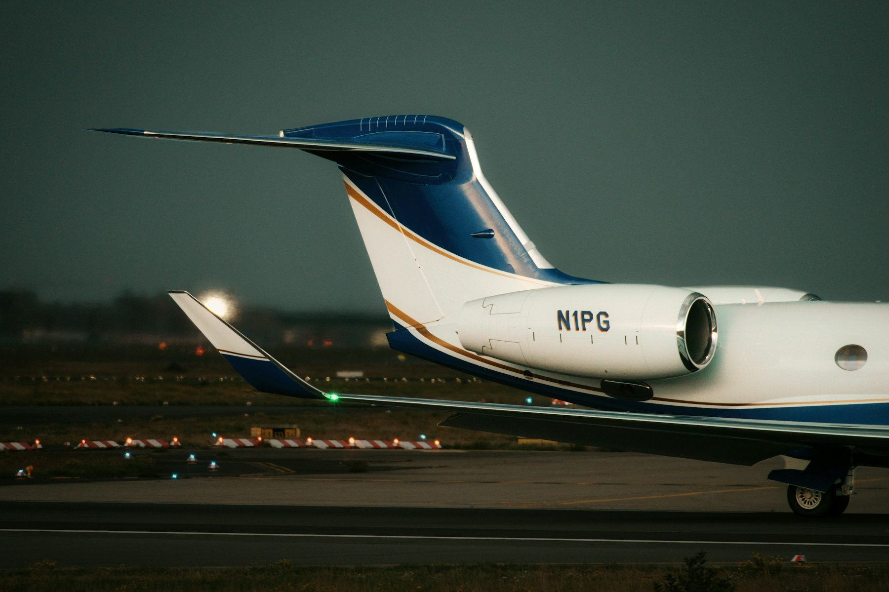Close-up of a business jet on the tarmac at dusk